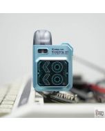 Uwell Caliburn GK3 25W pod system in light blue lifestyle photo on desk showing square display screen